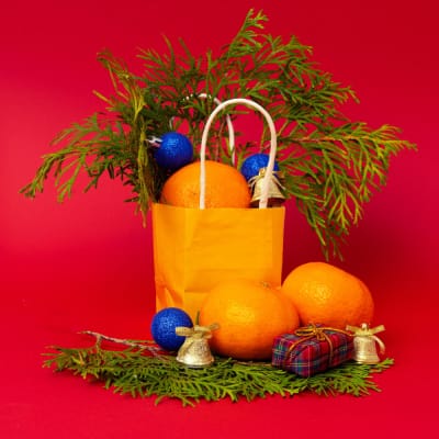festive paper bag oranges Paper bag with festive decoration and oranges